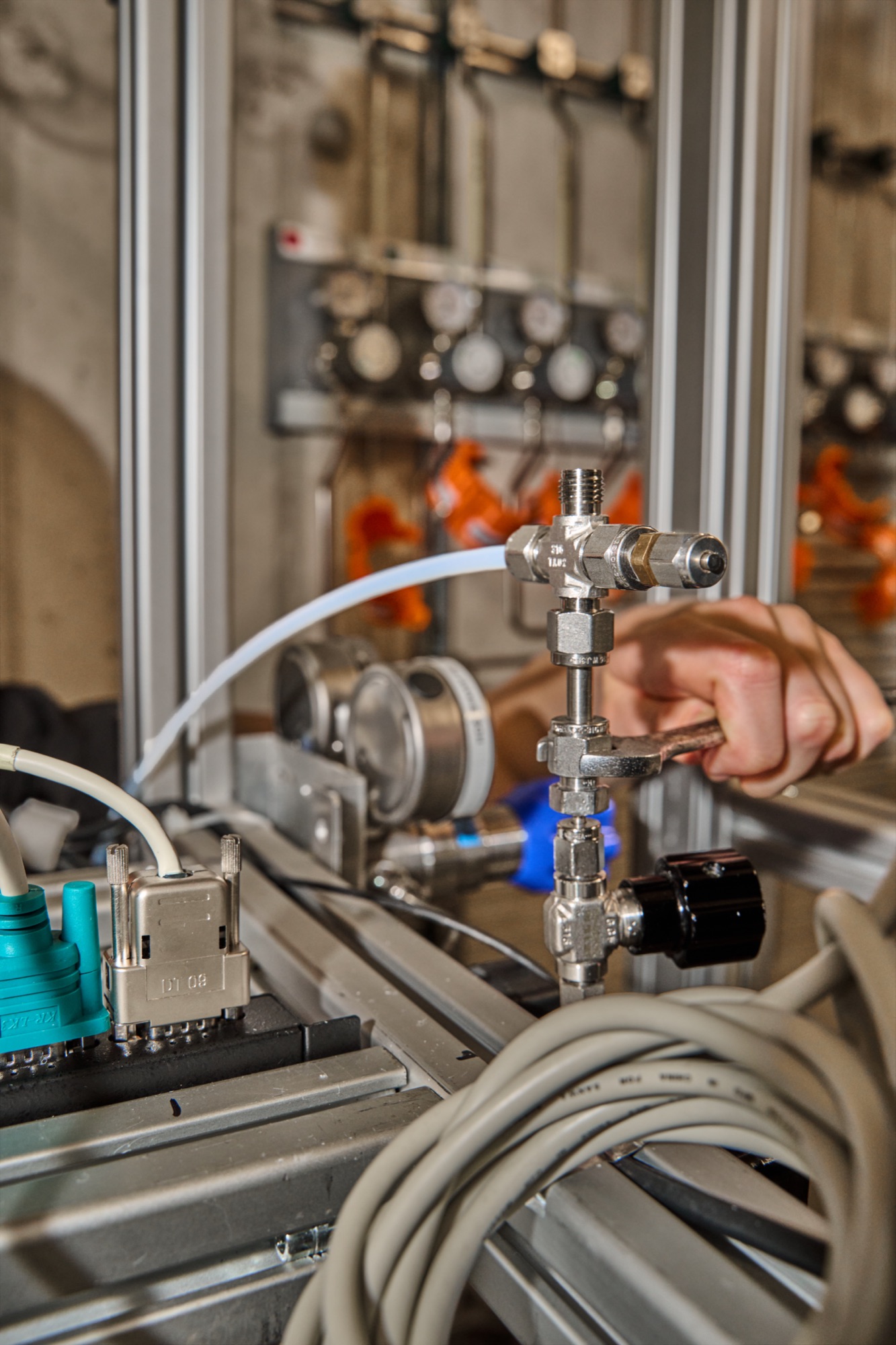 Engineer adjusting a valve on the catalyst test rig